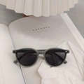Detail shot of gray TR90 kids round sunglasses with metal accents and polarized lenses - Gray