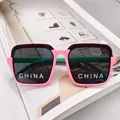 Detail of kids square sunglasses with tricolor frame and dark UV protective lenses - Pink