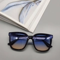 Detailed macro view of large square frame sunglasses with blue and orange gradient lenses - Black Frame Blue-Tea Lens