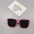 Detail view of pink and purple children's sunglasses with polarized lenses on a grey background - Pink