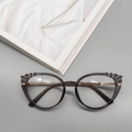Lunettes anti-lumière bleue TR90 gris transparent avec branches dorées et détails plissés - Gris Transparent