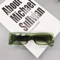 Retro rectangle sunglasses featuring a translucent dark green frame and shaded lenses - Transparent Green