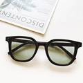 Detail of small rectangular sunglasses with black frame and light green lenses - Black Frame Green Lens