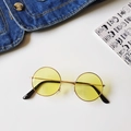 Detail of round gold metal sunglasses with yellow lenses and retro vintage design - Yellow