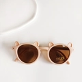 Detail of round bear ear sunglasses for kids with matte finish and UV400 protection - Pink