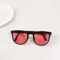 Kids folding sunglasses with black frame, silver rivets, and pink ocean lenses - Clear Grey Pink Lens