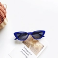 Kids royal blue cat eye sunglasses with UV400 protection on a minimalist background - Royal Blue