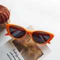 Orange cat eye sunglasses for kids with UV400 protection on a minimalist background - Orange