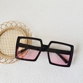Kids blush sunglasses featuring oversized black frames and pink gradient lenses - Square Oversized Style