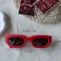 Modern rectangular red sunglasses with textured frames and dark UV protection lenses - Red