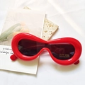Kids red bubble round frame sunglasses with UV400 protection on white texture - Kids Red
