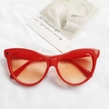Hip hop style red cat eye sunglasses with orange gradient lenses on white fabric - Red