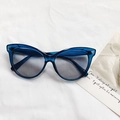 Chic blue transparent cat-eye sunglasses with gradient grey lenses on white fabric - Blue