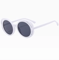 Detail of oversized white round sunglasses with stylish hollow frame design and dark lenses - White Frame Gray Lens