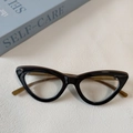 Lunettes de soleil œil de chat vintage en monture noire et marron en résine de qualité - Thé Transparent Verre Blanc