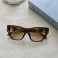 Vue de dessus de lunettes de soleil œil de chat ambrées avec détails en métal pixel - Vert