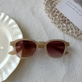 Vintage oval sunglasses with beige frame and tea tinted lenses for chic streetwear styling - Jelly Tea
