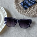 Retro square purple translucent sunglasses with gradient lenses in a lifestyle setting - Transparent Blue