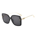 Detail of square oversized sunglasses with gold metal temples and interlaced logo - Black Frame Grey Lens