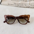 Detail view of butterfly cat eye sunglasses with brown matte frames and gradient lenses - Dark Tea with Green Lens