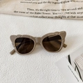 Detail of khaki cat eye sunglasses with unique thick frames and stylish cut-out edges - Premium Grey