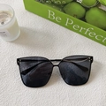 Detail of black oversized square sunglasses with silver rivets on a minimalist background - Black and Gray