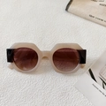 Detail view of round beige frames with dark brown patchwork on retro fashion sunglasses - Jelly White