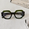 Dettaglio degli occhiali da sole rotondi bicolore con montatura traslucida verde e nera - Lente Bianca Verde Trasparente