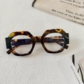 Detailed macro view of retro tortoiseshell frames with 13160 specification on inner temple - Tortoise Black White Lens