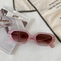 Detail of pink translucent irregular oval sunglasses with brown gradient lenses - Pink