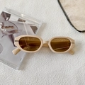 Detail of vintage geometric sunglasses with cream frames and silver metal hinges - Off White