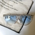 Detail of oversized sunglasses with blue gradient lenses and silver rhinestone tassels - Transparent Frame Blue Gradient Rhinestone Tassel