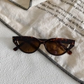 Detailed shot of retro cat eye sunglasses with tortoiseshell frames and brown lenses - Dark Tortoise Frame Brown Lens