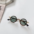 Detail view of steampunk kids' round sunglasses with gold metal frame and dark green lenses - Dark Green