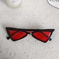 Flat lay of vintage triangle cat-eye sunglasses with red lenses and black frame - Black Red