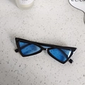 Flat lay of vintage triangular kids sunglasses with blue lenses on marble surface - Black Blue