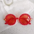 Detail of red round frame sunglasses with white lettering and gold bee accents - Letter Bee Decoration Style