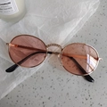 Macro view of pink oval lenses with rhinestone inlay on rose gold metal frame - Rhinestone Oval Pink