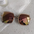 Detailed macro view of geometric golden metal frame sunglasses with rose gold gradient lenses - Pink Mercury Geometric