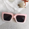 Close-up of pink and cream dual-tone matte square sunglasses for kids with dark lenses - Pink White