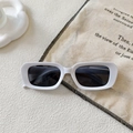 Detailed top view of retro white rectangular sunglasses with dark lenses on fabric - Off-White Grey