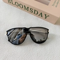 Detail of black square sunglasses with gold metal hinges and dark lenses on a white background - Black Frame Silver Mirror