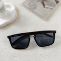 Close-up of black square sunglasses with silver metal bridge detail on a white surface - Dark Grey