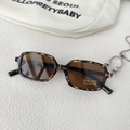 Detailed close-up of leopard print retro square sunglasses with UV400 CE protection lenses - Tortoise Frame Tea Lens