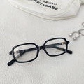 Detail of black rectangular kids sunglasses with UV400 lenses and CE certification - Black Frame Clear Lenses