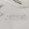 Detail of transparent square sunglasses with UV400 protection and gold hinge accents - Transparent White