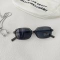 Detail of grey transparent square kids sunglasses with UV400 protection lens and label - Transparent Grey Frame Grey Lens
