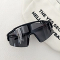 Close-up of black sports cycling sunglasses with wide frame and white storage pouch - Dark Grey