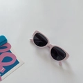 Detail of pink cat eye sunglasses with grey UV lenses and silver metallic dots - Light Pink