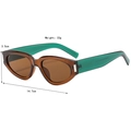 Cat eye sunglasses with transparent brown frames and contrasting green arms in 3/4 view - Transparent Tea